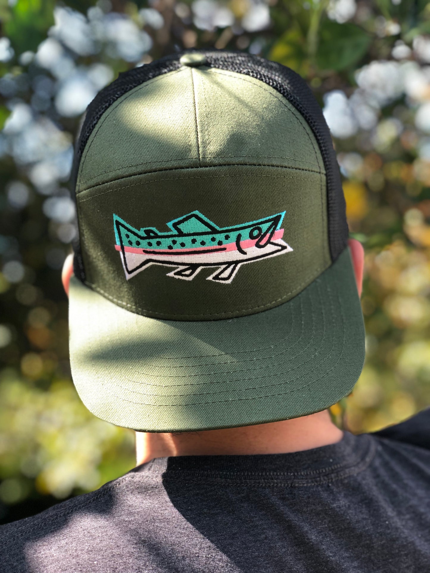 Thunderbird Design StudioIcon series - Rainbow Trout 7-panel Trucker HatIcon series - Rainbow Trout 7-panel Trucker HatHatsDark Green on Black mesh. Snap back/One size
Icon series - Rainbow trout - snap back trucker cap.