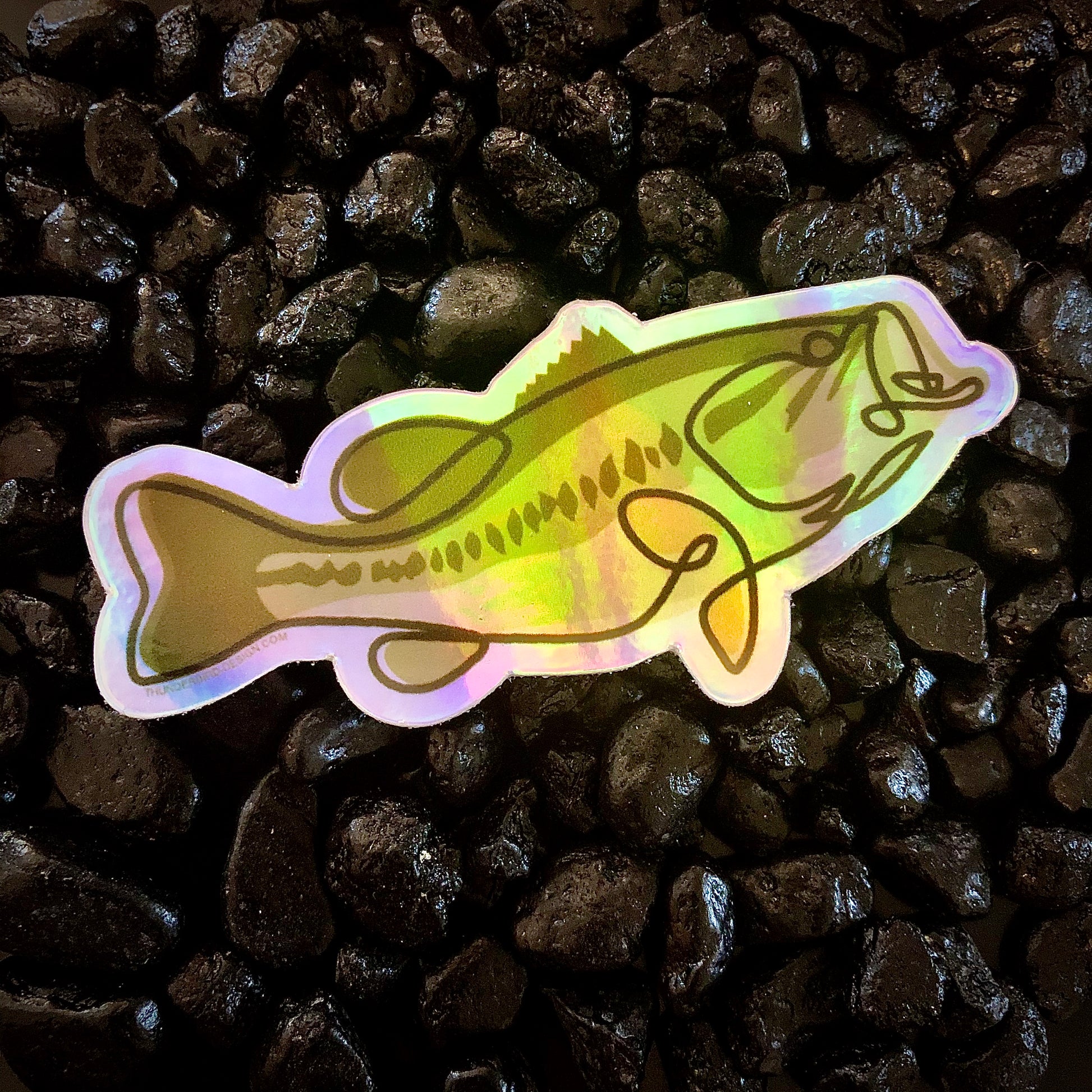 Thunderbird Outdoor SupplyLarge Mouth Bass - Single Line Series Holographic StickerLarge Mouth Bass - Single Line Series Holographic StickerSingle Line Contour Illustration of a Large Mouth Bass. Weatherproof holographic stickers perfect for your laptop, water bottle, car or whatever else you can stick i